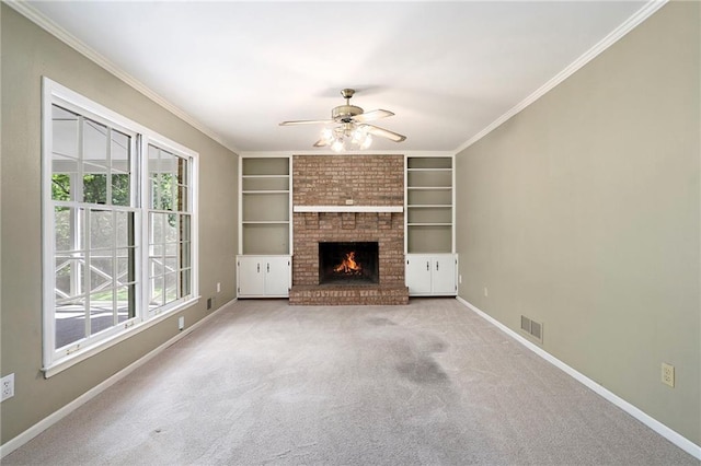 1703 W Nancy Creek Dr NE, Brookhaven, GA 30319 - unfurnished living room featuring ceiling fan, baseboards, carpet, a fireplace, and built in shelves