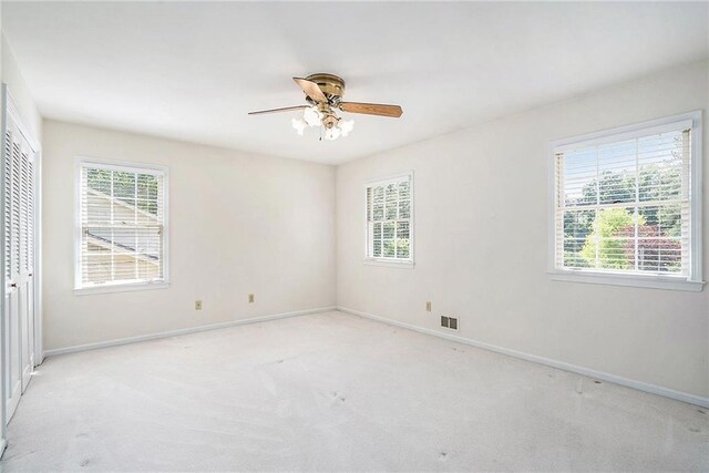 1703 W Nancy Creek Dr NE, Brookhaven, GA 30319 - unfurnished room with baseboards, a ceiling fan, and light carpet