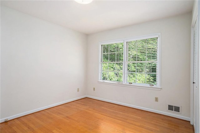 1703 W Nancy Creek Dr NE, Brookhaven, GA 30319 - unfurnished room featuring baseboards and light wood-style flooring
