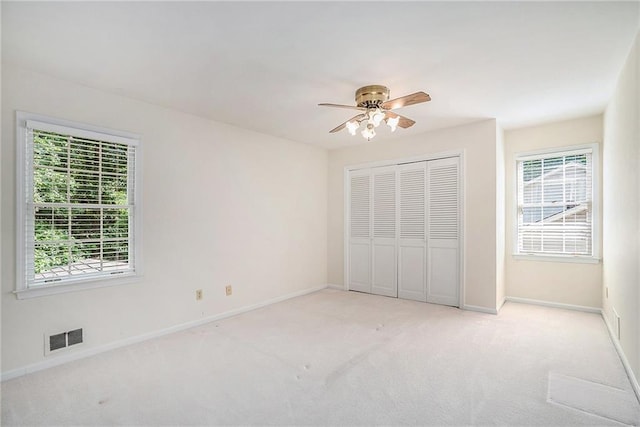 1703 W Nancy Creek Dr NE, Brookhaven, GA 30319 - unfurnished bedroom with carpet flooring, baseboards, a closet, and ceiling fan