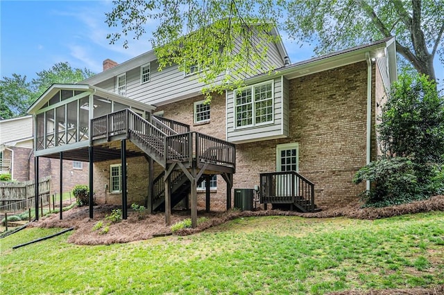1703 W Nancy Creek Dr NE, Brookhaven, GA 30319 - back of property with a sunroom, stairway, brick siding, a chimney, and a wooden deck