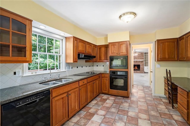 1703 W Nancy Creek Dr NE, Brookhaven, GA 30319 - kitchen with black appliances, a sink, under cabinet range hood, and backsplash