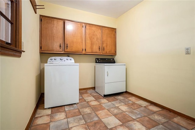 1703 W Nancy Creek Dr NE, Brookhaven, GA 30319 - laundry room featuring separate washer and dryer, cabinet space, baseboards, and stone finish flooring