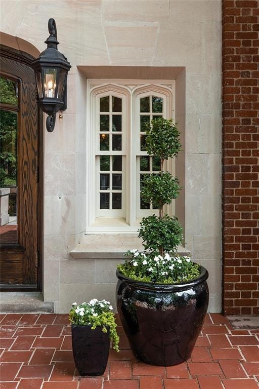 property entrance featuring brick siding