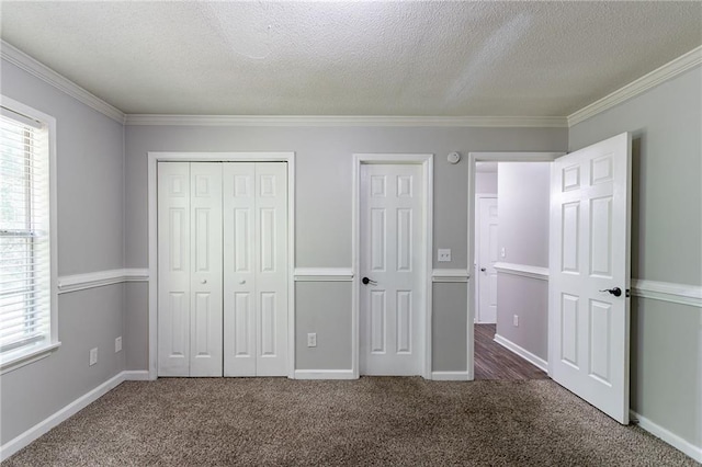 7384 Birch Hollow Pl, Douglasville, GA 30134 - unfurnished bedroom with ornamental molding, carpet flooring, a textured ceiling, a closet, and baseboards