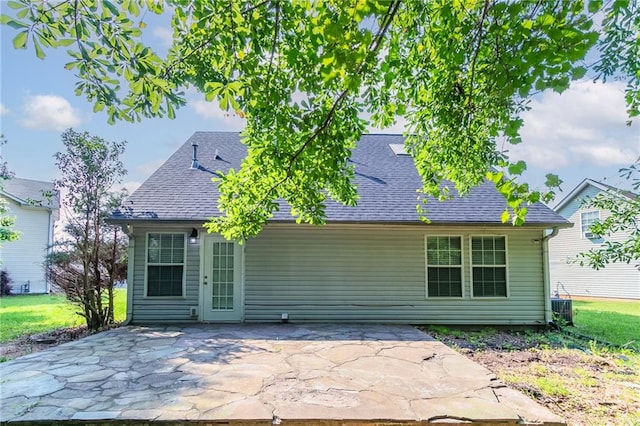 7384 Birch Hollow Pl, Douglasville, GA 30134 - back of house featuring a patio, roof with shingles, and central AC