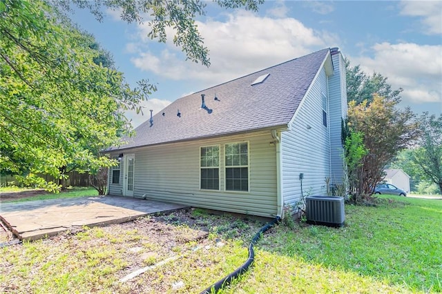 7384 Birch Hollow Pl, Douglasville, GA 30134 - back of property with a patio, central AC unit, a lawn, and roof with shingles