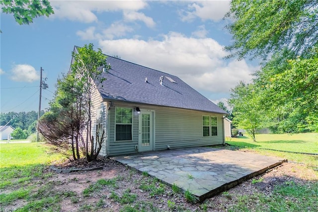 7384 Birch Hollow Pl, Douglasville, GA 30134 - back of property with a patio area, a yard, and roof with shingles