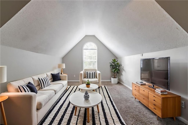 7384 Birch Hollow Pl, Douglasville, GA 30134 - living area with a textured ceiling, vaulted ceiling, carpet floors, and baseboards