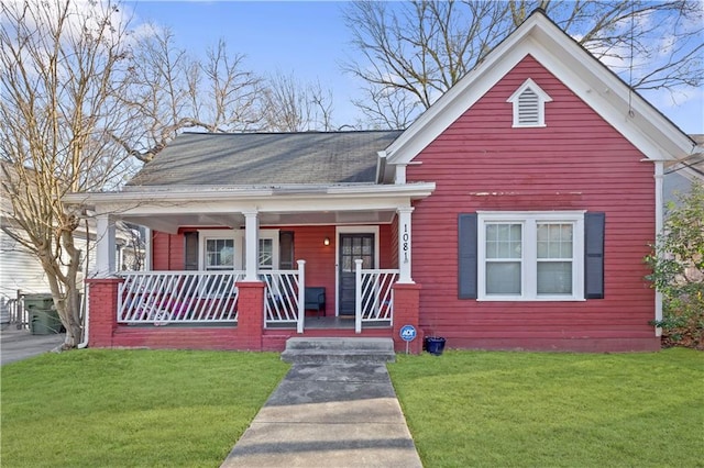 bungalow featuring a front lawn and a porch