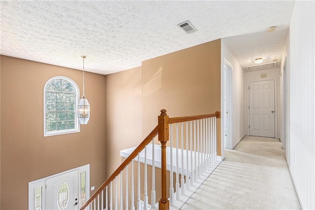 48 Savanna Ct, Powder Springs, GA 30127 - hall with a textured ceiling, light colored carpet, and an upstairs landing