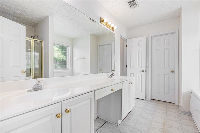 48 Savanna Ct, Powder Springs, GA 30127 - bathroom with double vanity, a stall shower, and a textured ceiling