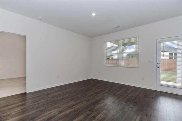 977 Daurian Dr, Statham, GA 30666 - empty room with dark wood-style floors and recessed lighting
