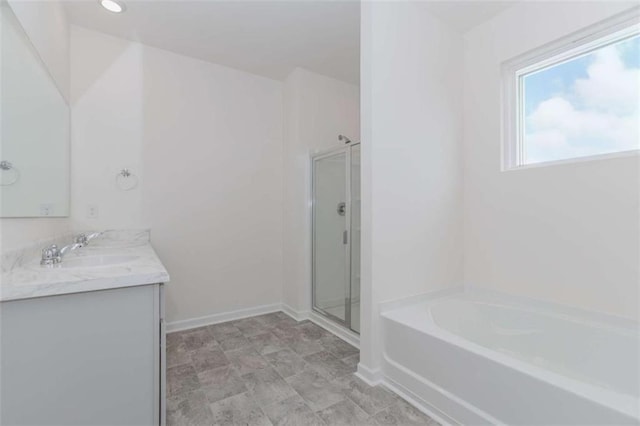 977 Daurian Dr, Statham, GA 30666 - bathroom with a garden tub, double vanity, and a shower stall