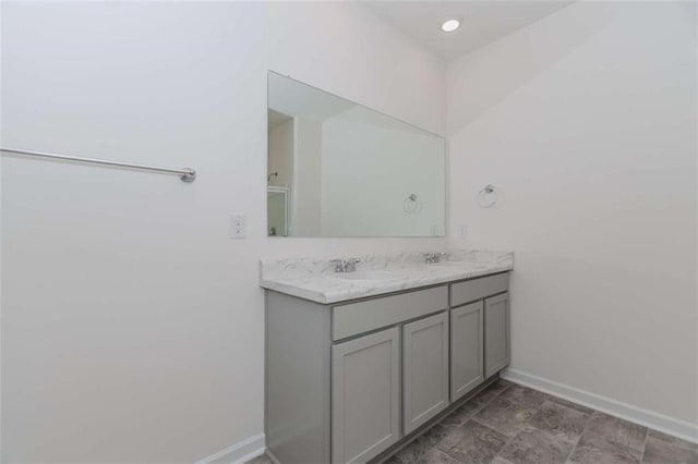 977 Daurian Dr, Statham, GA 30666 - bathroom with double vanity and baseboards