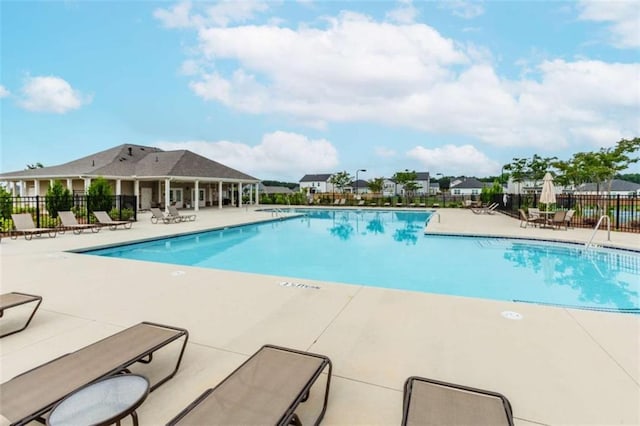 977 Daurian Dr, Statham, GA 30666 - community pool featuring a patio area