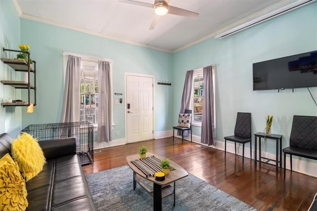 living room featuring ceiling fan, dark hardwood / wood-style flooring, and ornamental molding