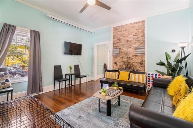 living room with ceiling fan, ornamental molding, and hardwood / wood-style flooring