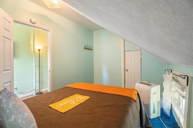 carpeted bedroom featuring lofted ceiling, a closet, and a textured ceiling