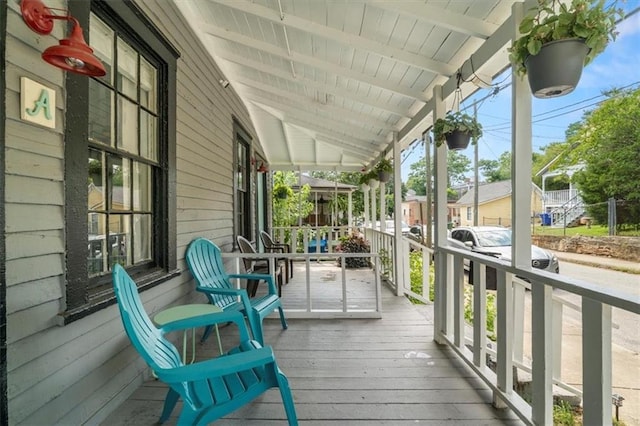 wooden deck featuring covered porch