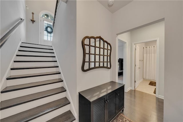 stairs with hardwood / wood-style floors