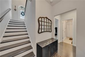 stairway with hardwood / wood-style flooring