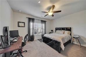 bedroom with ceiling fan and carpet flooring