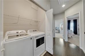 washroom featuring dark hardwood / wood-style flooring and independent washer and dryer