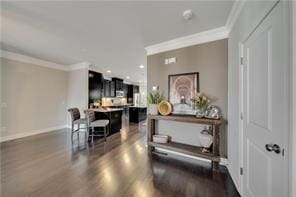 interior space with crown molding and dark wood-type flooring