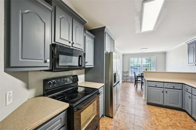 330 Pitts Chapel Rd, Newborn, GA 30056 - kitchen featuring black appliances, light tile patterned flooring, gray cabinetry, and light countertops