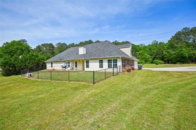 330 Pitts Chapel Rd, Newborn, GA 30056 - rear view of house with fence, driveway, and a yard