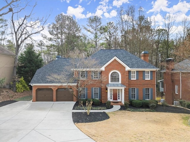 colonial-style house featuring a garage