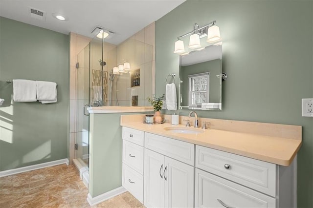 bathroom featuring vanity and walk in shower