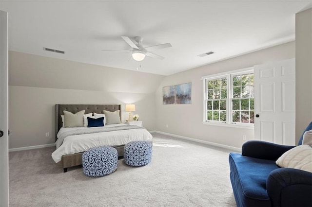 bedroom with vaulted ceiling, light carpet, and ceiling fan