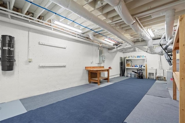 basement featuring sink and carpet floors