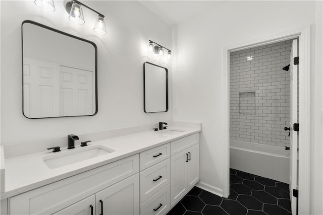 bathroom with a sink, bathing tub / shower combination, double vanity, and tile patterned flooring