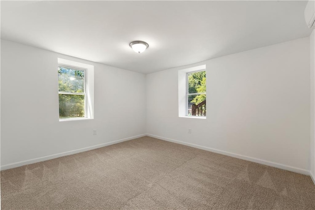 empty room with baseboards and carpet floors