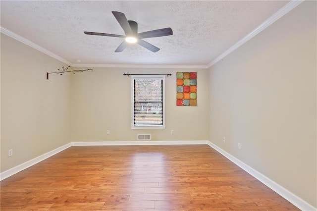 unfurnished room with a textured ceiling, light hardwood / wood-style flooring, ceiling fan, and ornamental molding