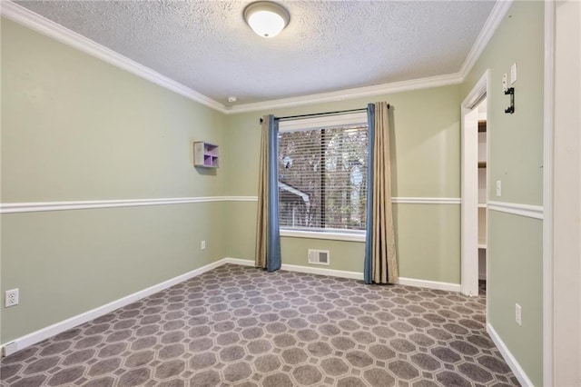 spare room with a textured ceiling and ornamental molding