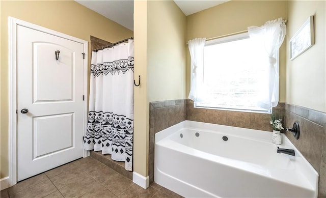 bathroom featuring tile patterned flooring and shower with separate bathtub