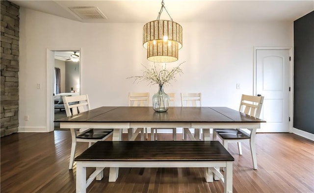 dining area with dark hardwood / wood-style floors and ceiling fan