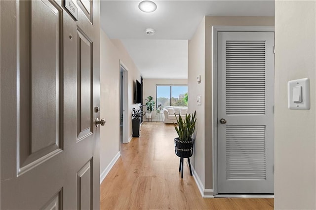 hallway with light wood-type flooring