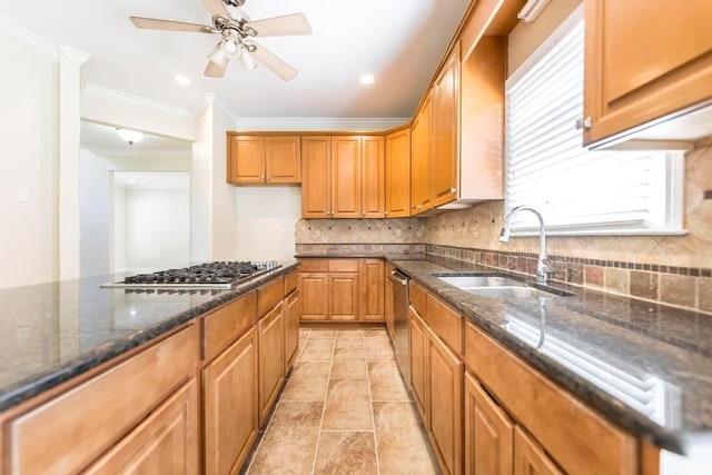 100 Bentwood Cir, Macon, GA 31210 - kitchen featuring a sink, ornamental molding, dark stone counters, decorative backsplash, and stainless steel appliances