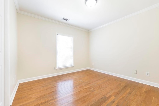 100 Bentwood Cir, Macon, GA 31210 - spare room with baseboards, ornamental molding, and light wood-style flooring