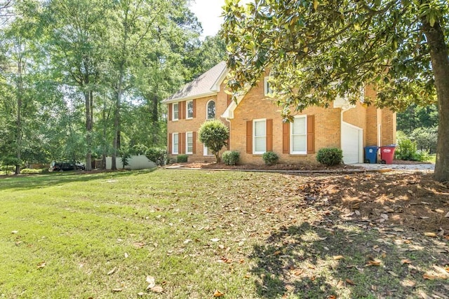 100 Bentwood Cir, Macon, GA 31210 - colonial house with brick siding, an attached garage, and a front yard