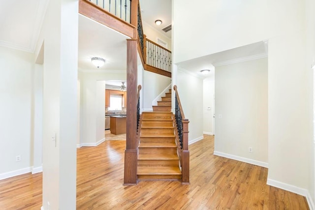 100 Bentwood Cir, Macon, GA 31210 - staircase with ornamental molding, wood finished floors, and baseboards