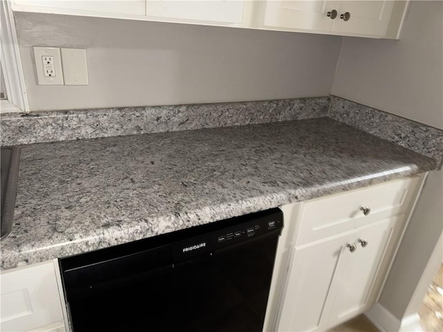 kitchen with dishwasher and white cabinets