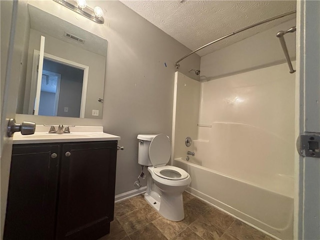 bathroom featuring visible vents, shower / washtub combination, toilet, vanity, and a textured ceiling