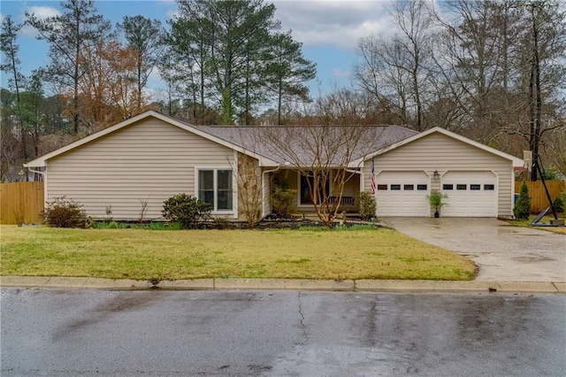 ranch-style house featuring a garage, concrete driveway, a front lawn, and fence