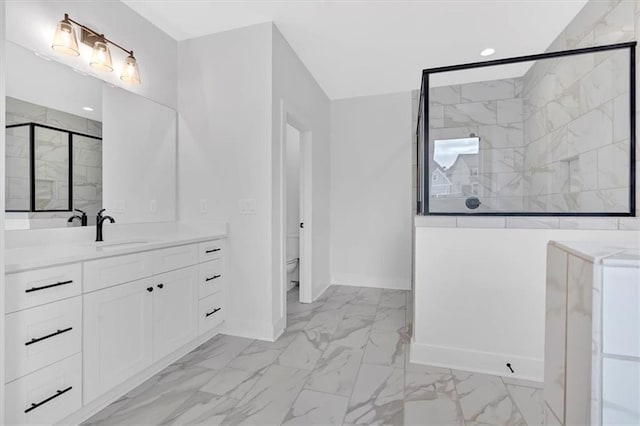 bathroom featuring vanity, an enclosed shower, and toilet